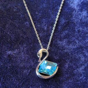 Silver Swan necklace with sparkly blue gem
